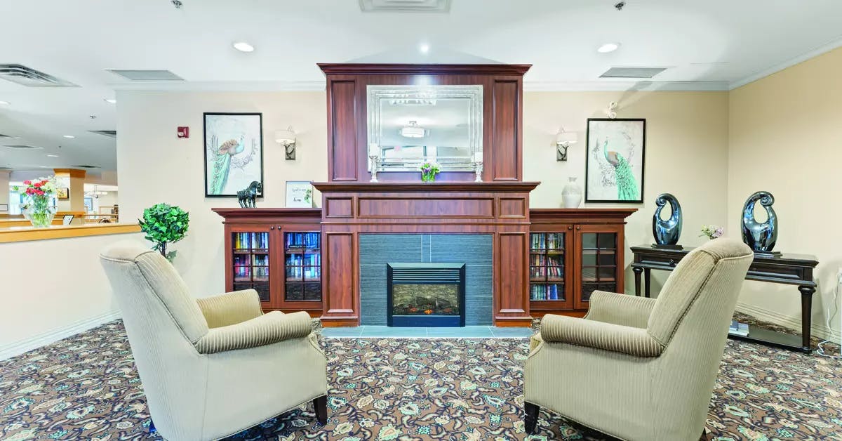 Chartwell Avondale Retirement Residence  lobby lounge with fireplace and seating