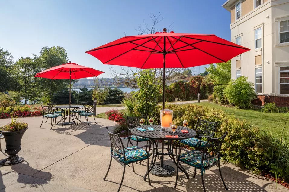 outdoor patio at chartwell conservatory pond retirement residence