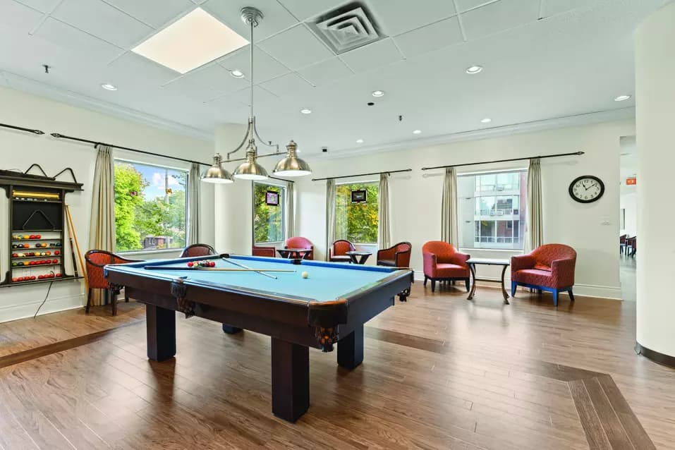 Spacious and illuminated common area of Chartwell Grenadier Retirement Residence