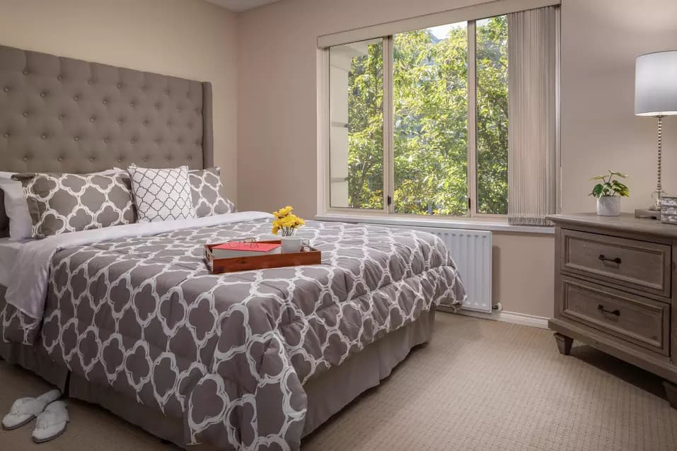 beautiful bedroom at chartwell crescent gardens retirement residence