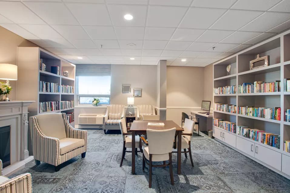 Chartwell Lakeshore Retirement Residence library with fireplace