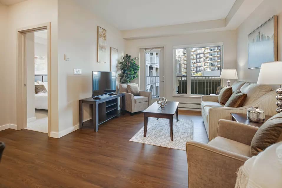 spacious living room at chartwell heritage valley retirement residence