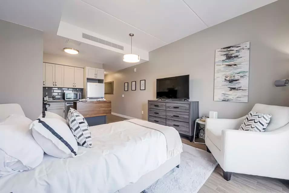 chartwell montgomery village, suite, sofa, tv, kitchen, studio
