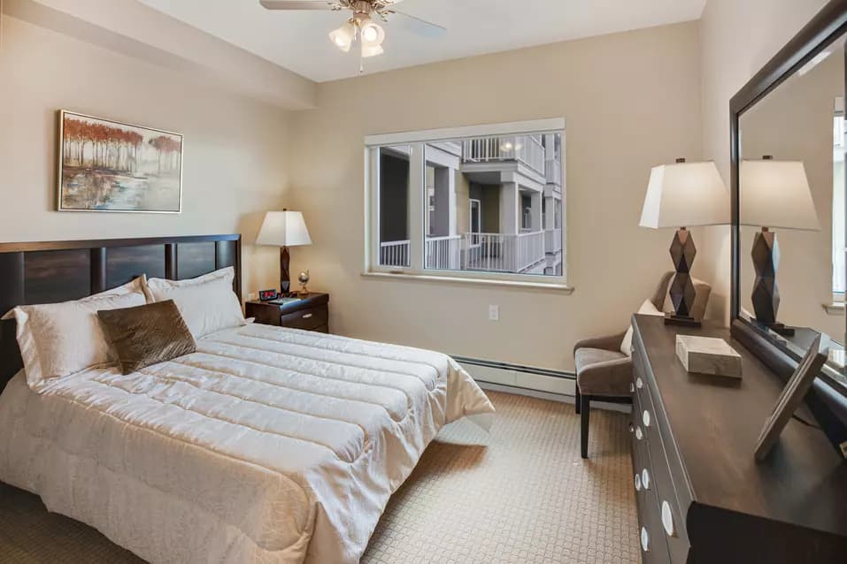 beautiful bedroom at chartwell heritage valley retirement residence