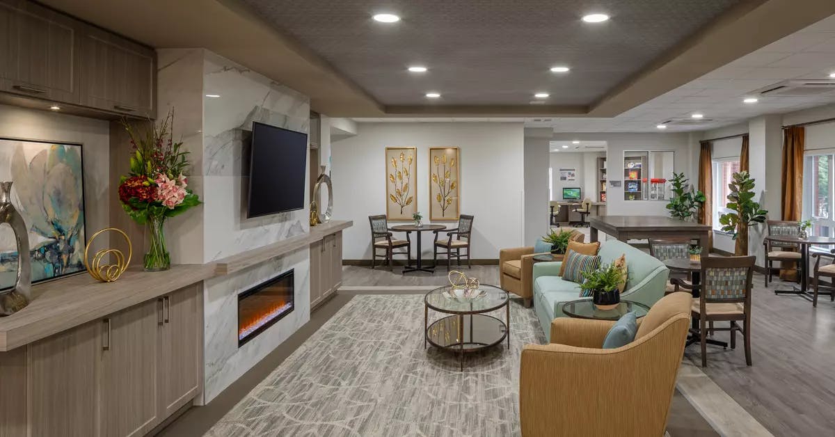 cozy fireplace lounge at chartwell carlton retirement residence
