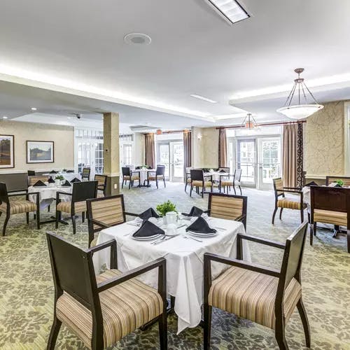 Open and bright dining room at Chartwell Orchards Retirement Residence